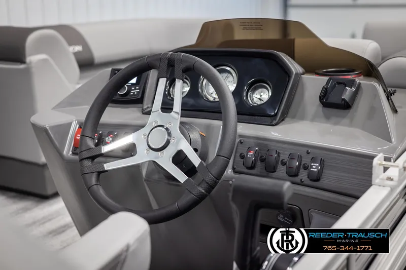 Slide: The Image of Steering console of 2025 Bennington 21 SLSE pontoon boat with gauges and controls. - 26