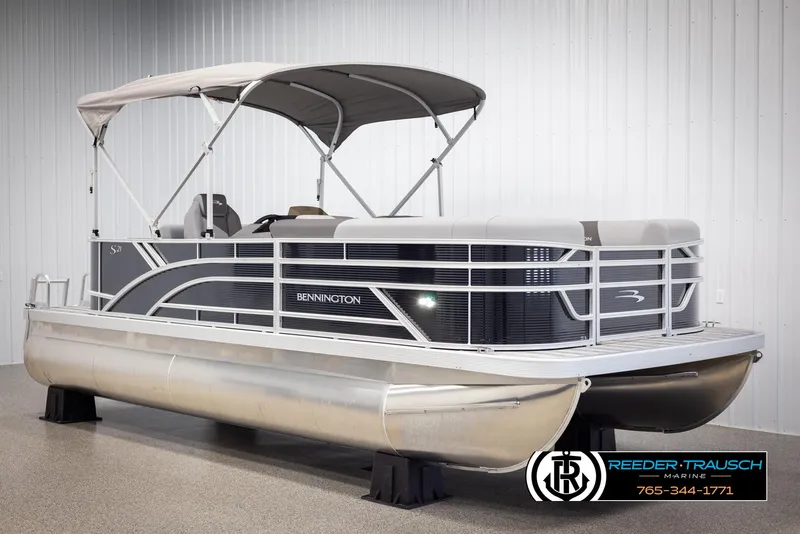 Slide: The Image of 2025 Bennington 21 SLSE pontoon boat with canopy in showroom. - 3