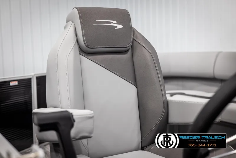 Slide: The Image of 2025 Bennington 21 SLSE boat seat, gray and black design, Reeder-Trausch Marine logo visible. - 34