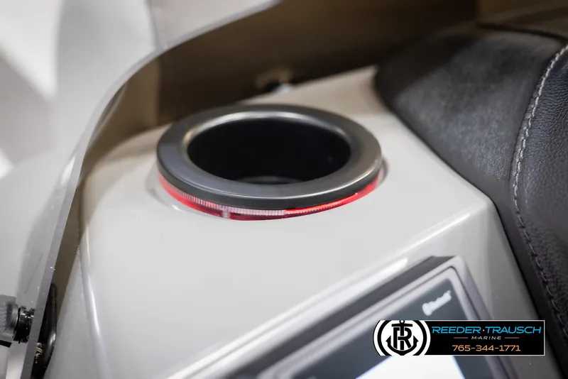 Slide: The Image of 2025 Bennington 21 SLSE boat cup holder with red LED lighting detail. - 38