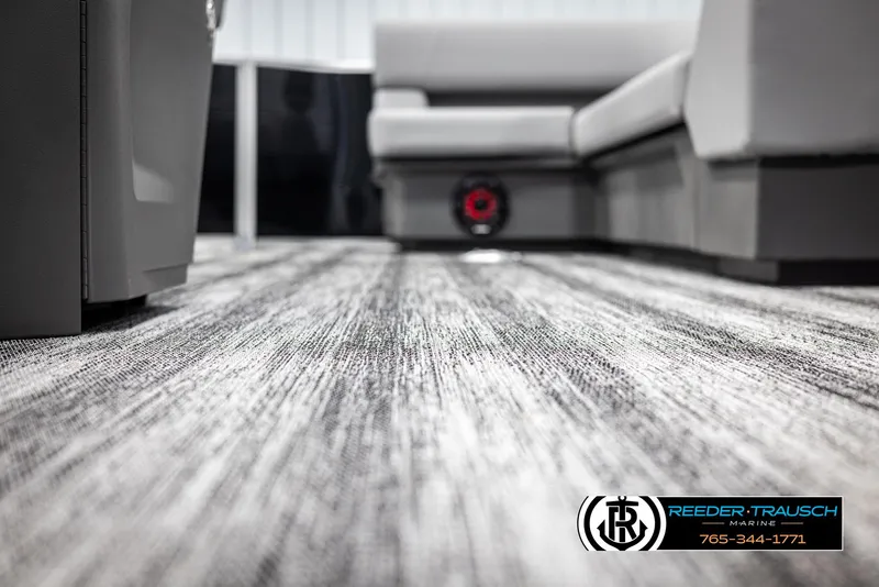 Slide: The Image of Interior of 2025 Bennington 21 SLSE pontoon boat with modern flooring and seating. - 41