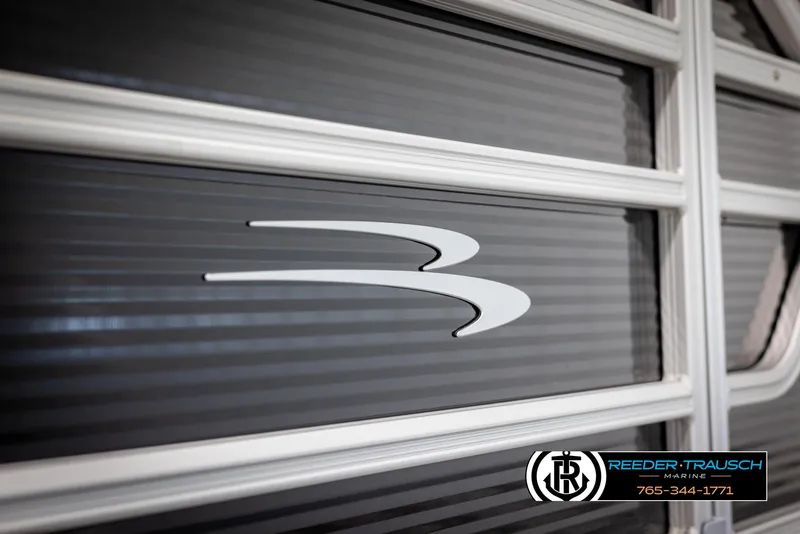 Slide: The Image of 2025 Bennington 21 SLSE boat detail with logo and Reeder-Trausch Marine branding. - 42