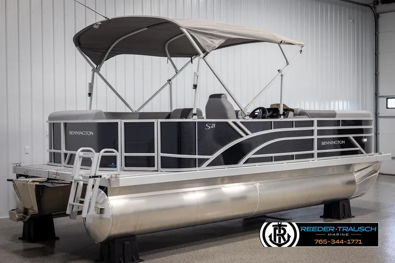 Slide: The Image of 2025 Bennington 21 SLSE pontoon boat with canopy in showroom. - 6