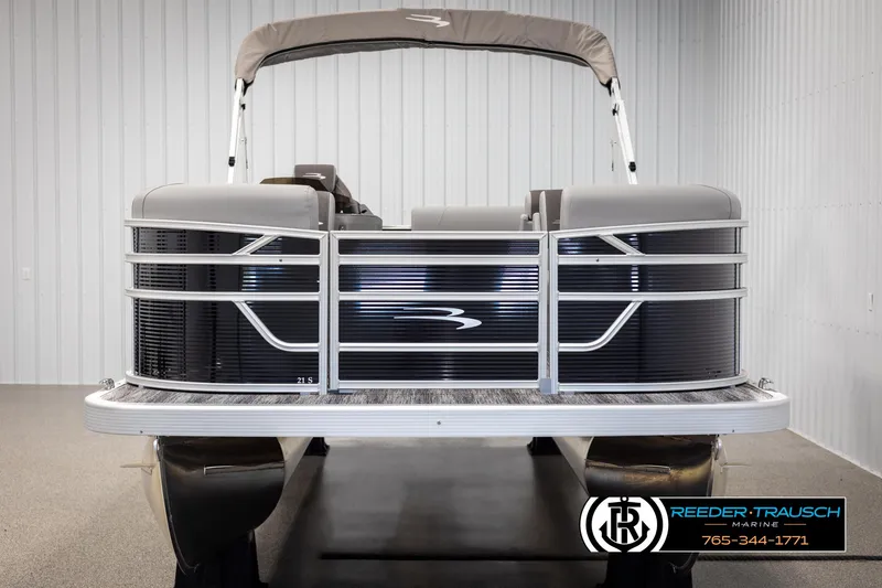 Slide: The Image of 2025 Bennington 21 SLSE pontoon boat in showroom, front view. - 8