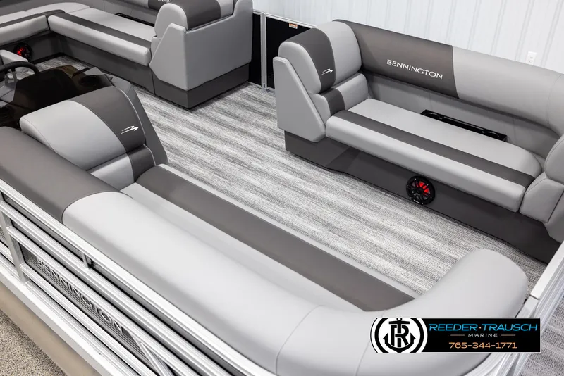 Slide: The Image of 2025 Bennington 21 SLSE pontoon boat interior with gray seating and carpeted flooring. - 9