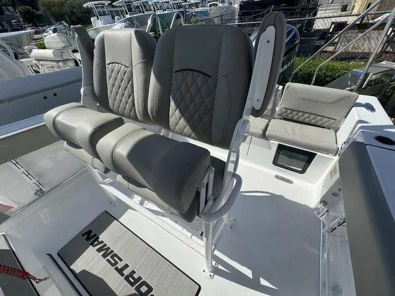 Slide: The Image of 2025 Sportsman Heritage 231 boat seating with cushioned seats and diamond stitching. - 24