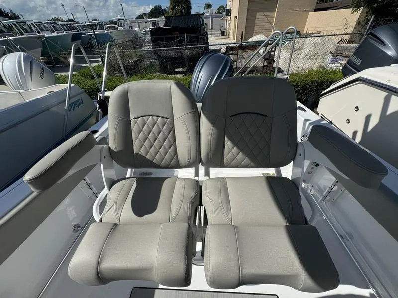 Slide: The Image of 2025 Sportsman Heritage 231 boat seats with quilted design, showcasing luxury and comfort. - 25