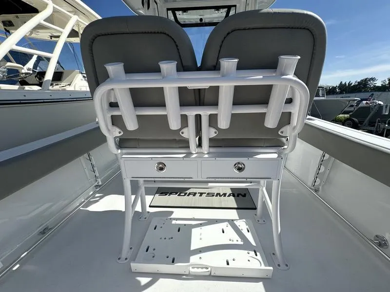 Slide: The Image of 2025 Sportsman Heritage 231 boat interior with dual seats and rod holders. - 26