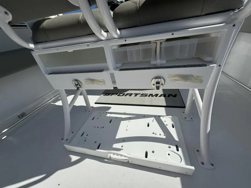 Slide: The Image of 2025 Sportsman Heritage 231 boat interior with storage compartments and seating. - 27