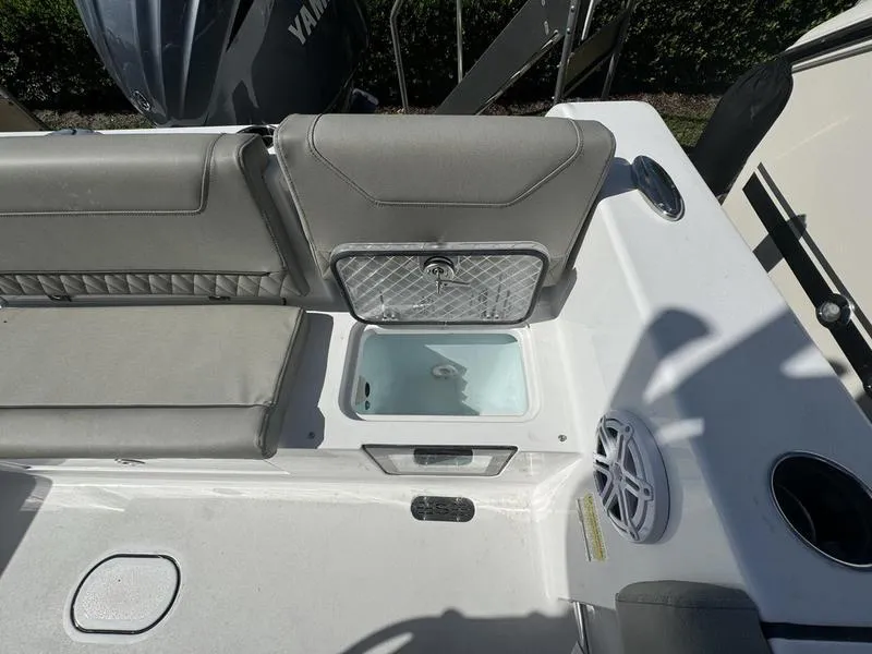 Slide: The Image of 2025 Sportsman Heritage 231 boat interior with seating and storage compartment. - 29