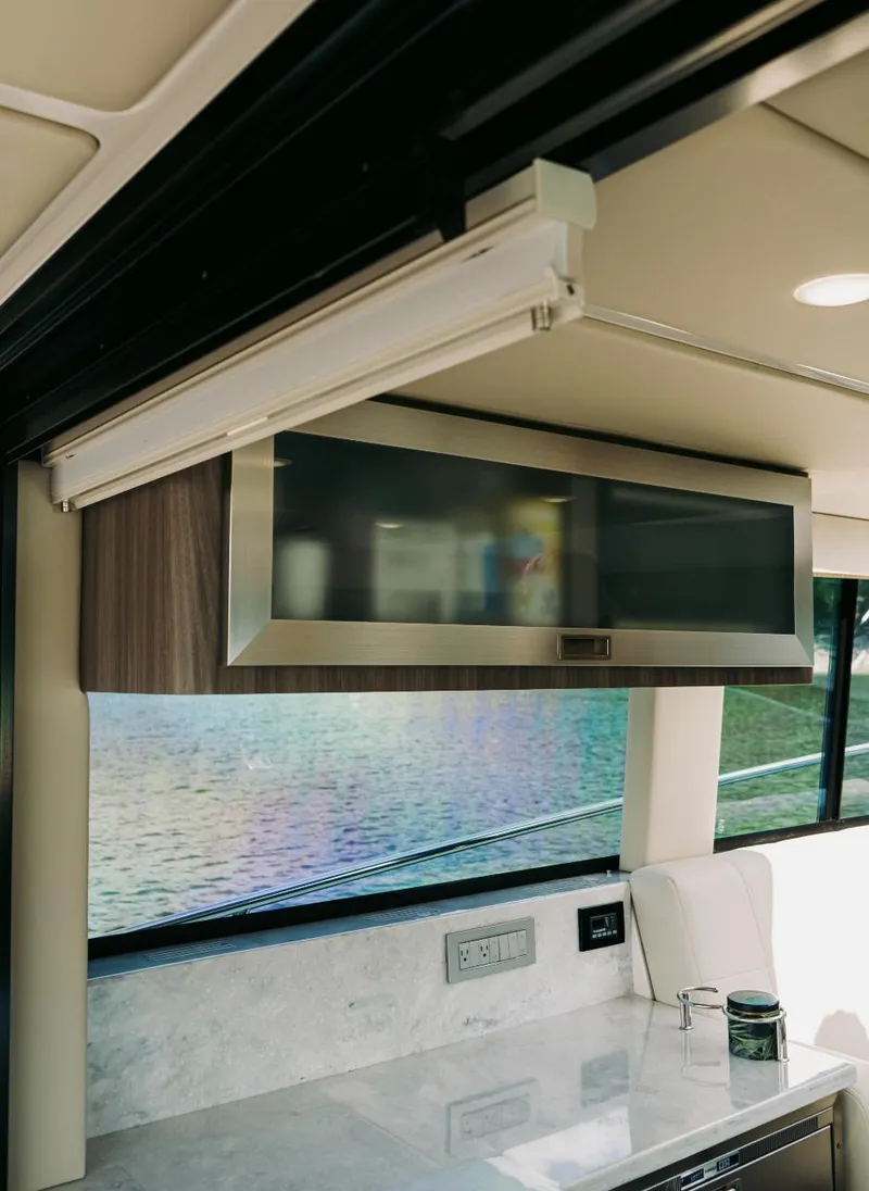 Slide: The Image of Interior of 2021 Regal 38 Grande Coupe yacht with modern kitchen cabinetry. - 6