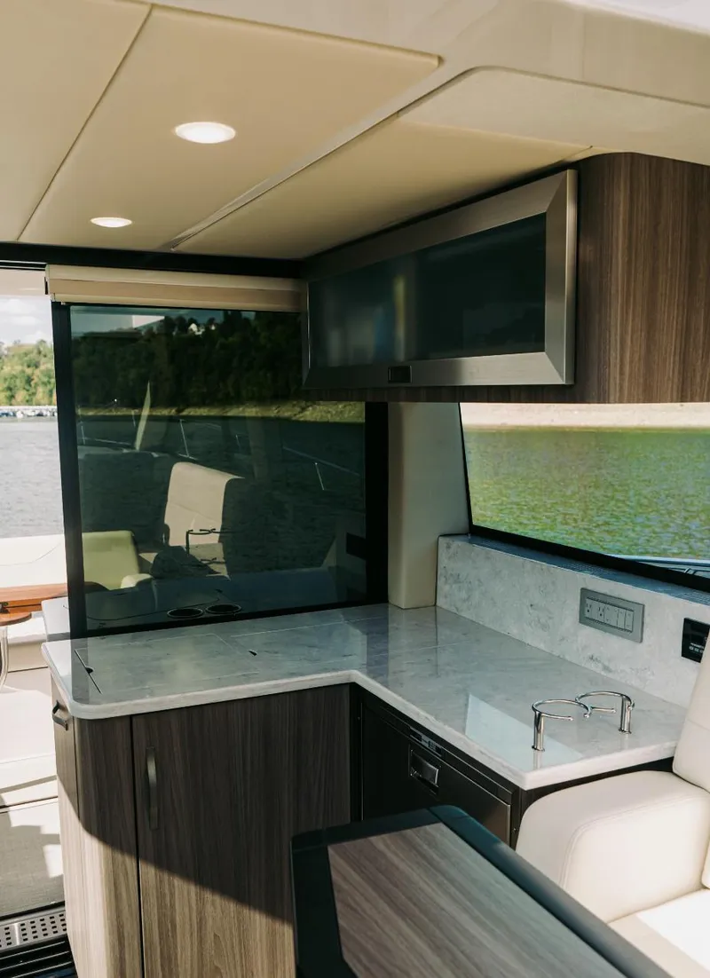 Slide: The Image of Interior of 2021 Regal 38 Grande Coupe yacht with modern kitchen design. - 9