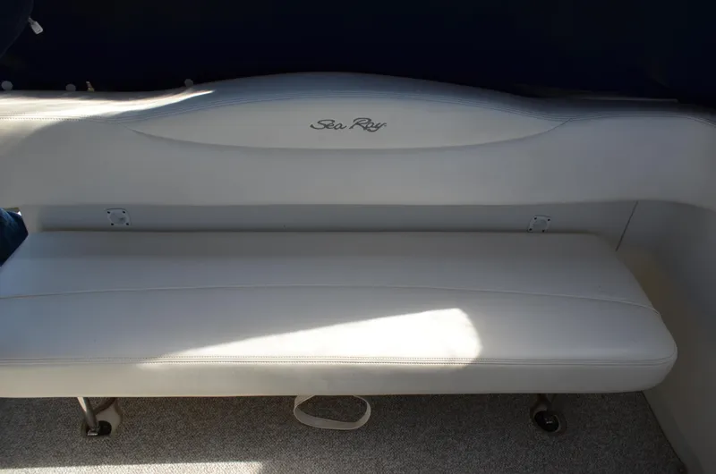 Slide: The Image of White leather seating on a 2004 Sea Ray 280 Sundancer boat. - 14
