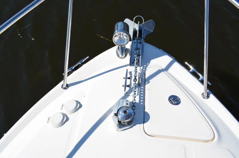 Slide: The Image of Bow of 2004 Sea Ray 280 Sundancer with anchor and railing. - 25