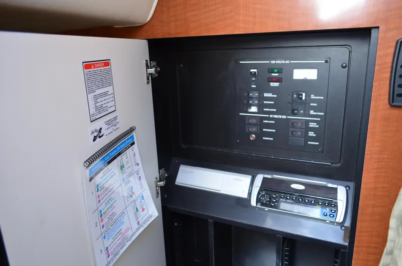 Slide: The Image of Electrical control panel inside 2004 Sea Ray 280 Sundancer boat cabin. - 33