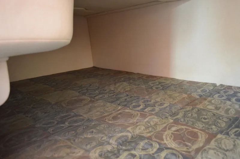 Slide: The Image of Interior cabin of 2004 Sea Ray 280 Sundancer with patterned flooring. - 35