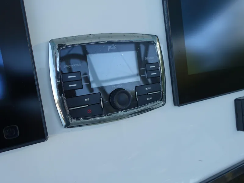 Slide: The Image of Control panel on a 2016 Regulator 41 boat dashboard. - 17