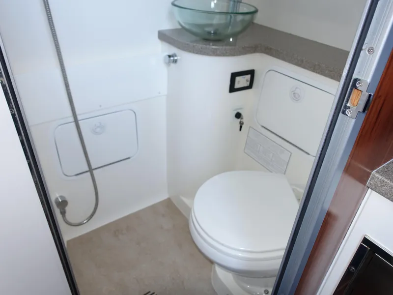 Slide: The Image of 2016 Regulator 41 boat bathroom with modern fixtures and glass sink. - 22