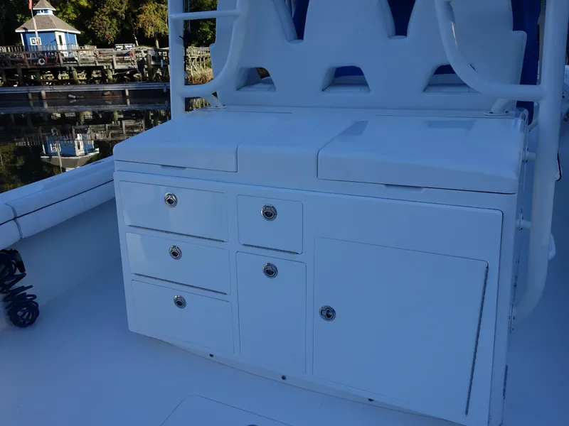 Slide: The Image of 2016 Regulator 41 boat with white storage cabinets on deck. - 7