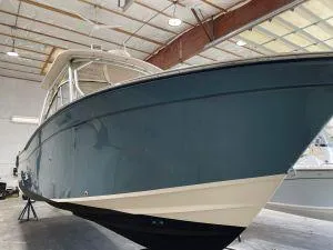 The Image of 2011 Grady-White 275 boat in a warehouse, side view. - 1