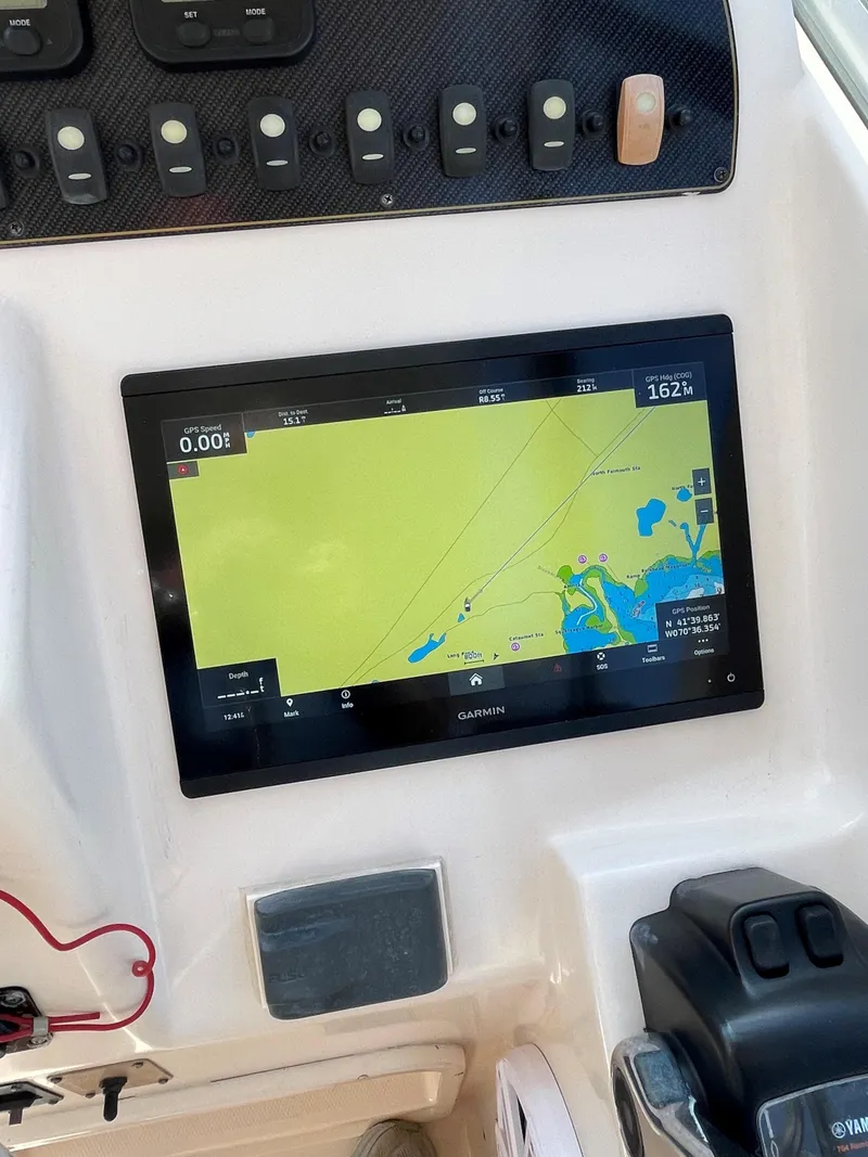 Slide: The Image of Boat dashboard with navigation screen on 2011 Grady-White 275 model. - 8