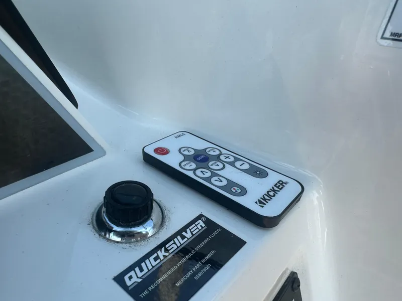 Slide: The Image of Bayliner DX 2000 boat dashboard with Kicker remote control, 2022 model. - 16