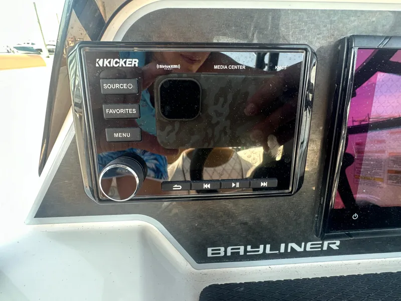 Slide: The Image of Bayliner DX 2000 2022 boat media center with Kicker audio system. - 6