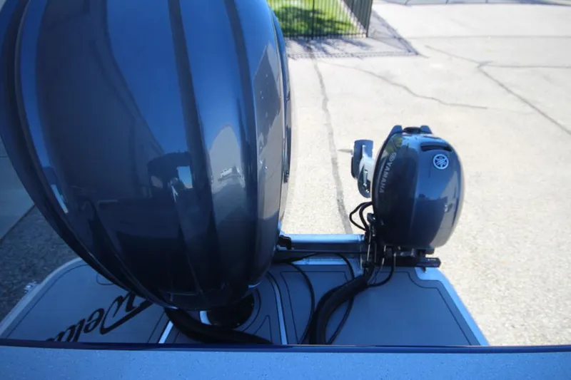 Slide: The Image of 2025 Weldcraft 240 Maverick DV boat engines, showcasing dual outboard motors. - 11