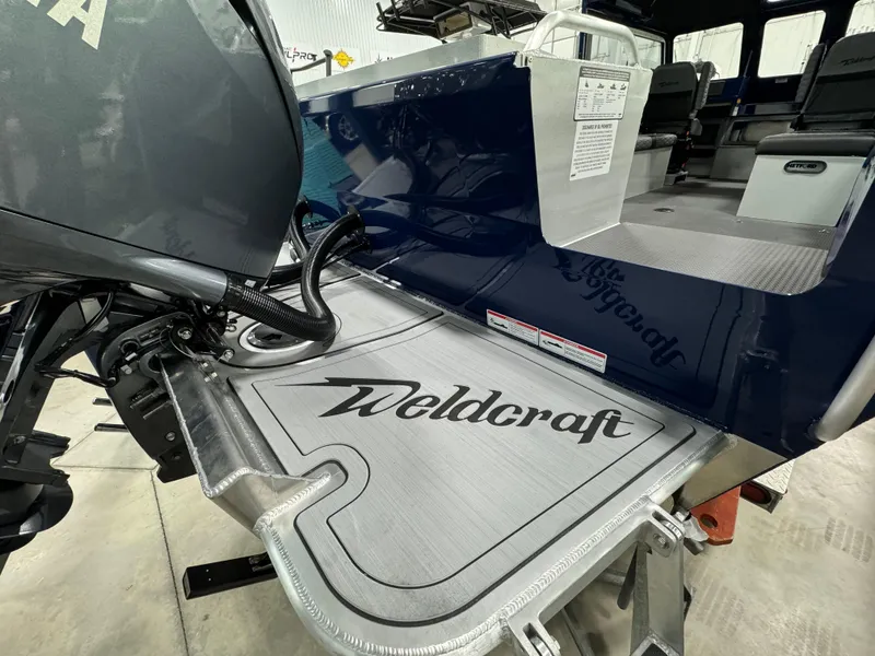 Slide: The Image of 2025 Weldcraft 240 Maverick DV boat with Yamaha engine, interior view. - 12