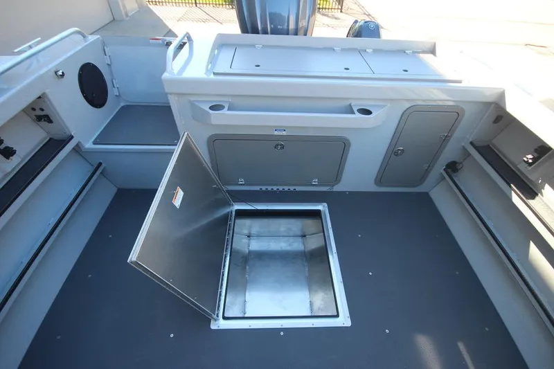 Slide: The Image of 2025 Weldcraft 240 Maverick DV boat interior with open storage compartment. - 16