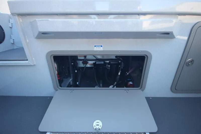 Slide: The Image of 2025 Weldcraft 240 Maverick DV F300XCB boat storage compartment, open and empty. - 18