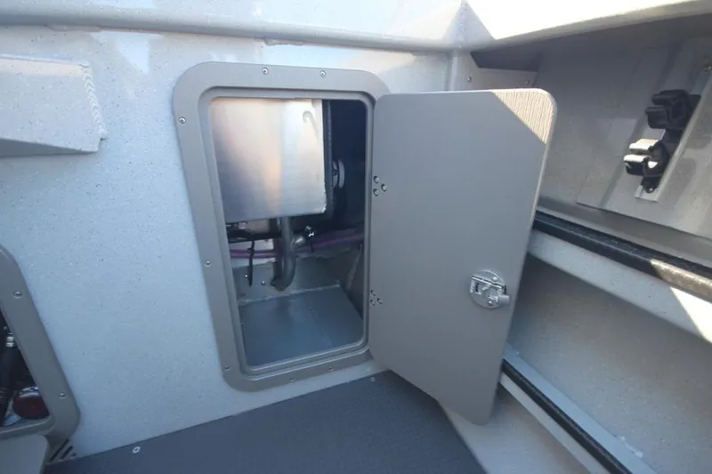 Slide: The Image of Open storage compartment in 2025 Weldcraft 240 Maverick DV boat interior. - 20