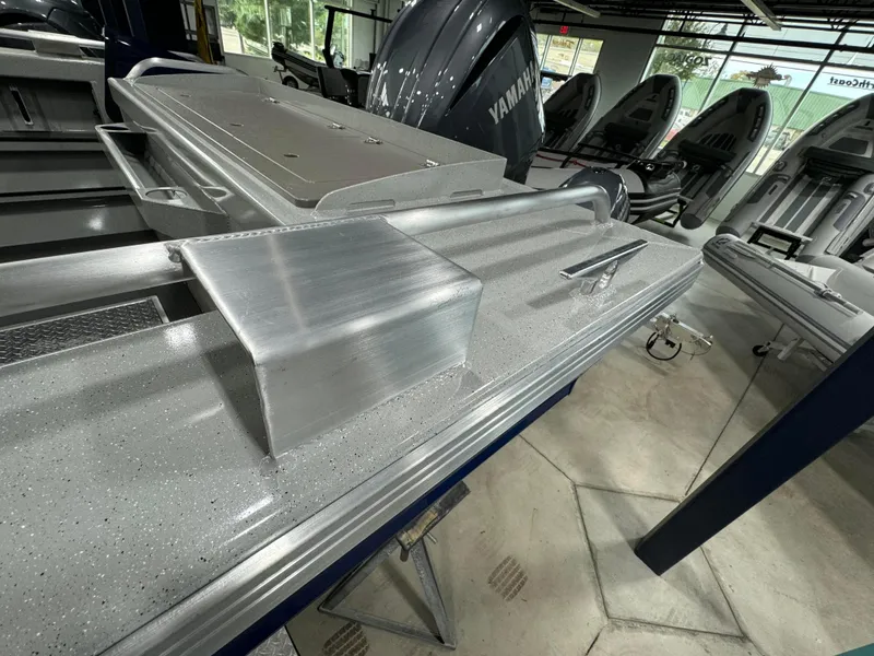 Slide: The Image of 2025 Weldcraft 240 Maverick DV boat interior with Yamaha engines in showroom. - 22