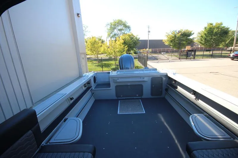 Slide: The Image of 2025 Weldcraft 240 Maverick DV boat interior, spacious deck, modern design, outdoor setting. - 23