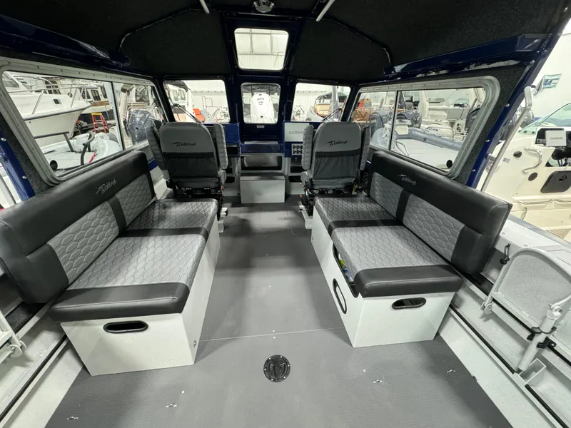 Slide: The Image of Interior of 2025 Weldcraft 240 Maverick DV boat, featuring spacious seating and modern design. - 26