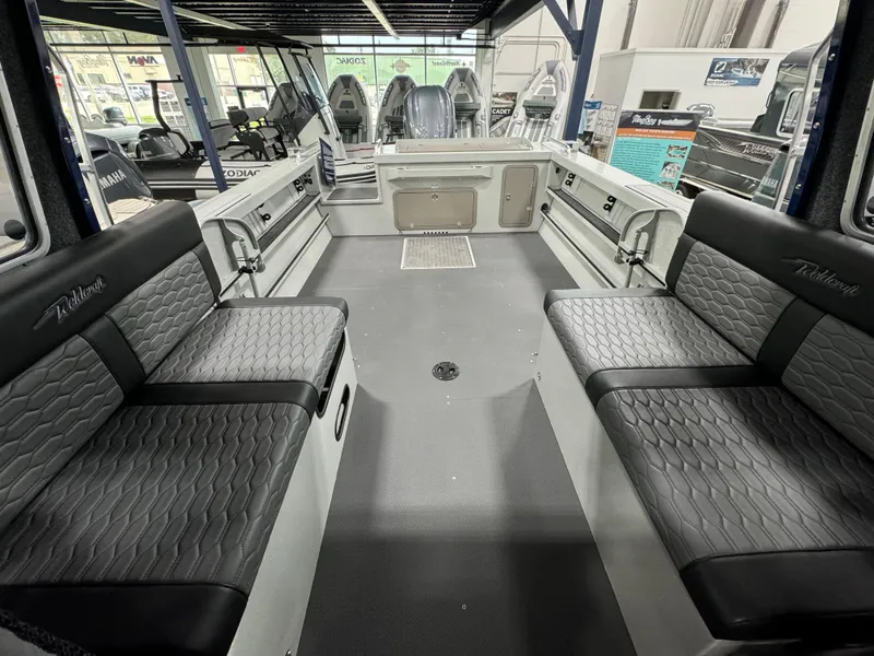 Slide: The Image of 2025 Weldcraft 240 Maverick DV boat interior with seating and storage compartments. - 27