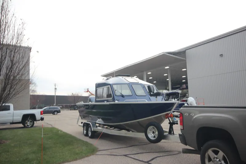 Slide: The Image of 2025 Weldcraft 240 Maverick DV boat on trailer outside dealership. - 3