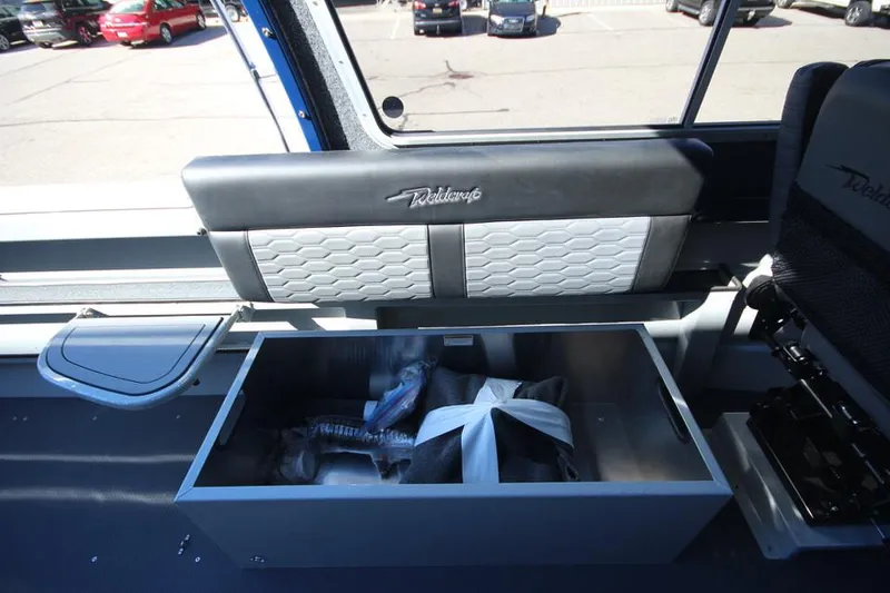 Slide: The Image of 2025 Weldcraft 240 Maverick DV interior storage compartment with seating. - 31