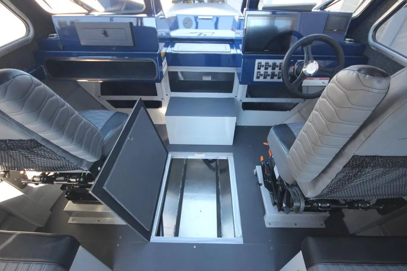 Slide: The Image of Interior of 2025 Weldcraft 240 Maverick DV boat with modern seating and control panel. - 34