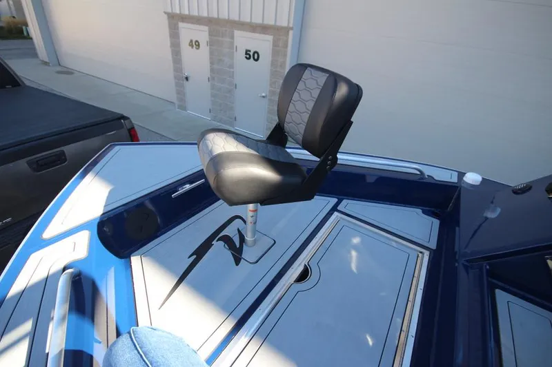Slide: The Image of 2025 Weldcraft 240 Maverick DV boat seat on deck, blue and gray design. - 49