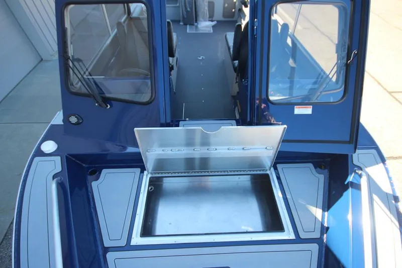 Slide: The Image of 2025 Weldcraft 240 Maverick DV boat interior with open storage compartment. - 50