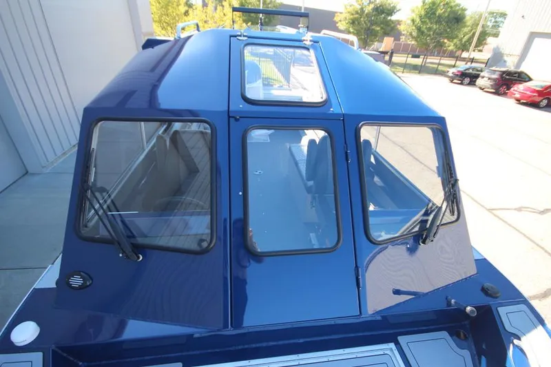 Slide: The Image of 2025 Weldcraft 240 Maverick DV boat with blue exterior, docked outdoors. - 51