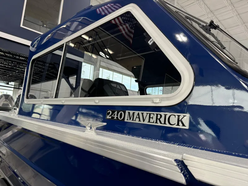 Slide: The Image of 2025 Weldcraft 240 Maverick DV boat, blue exterior, showroom display. - 8