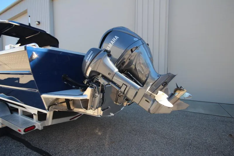 Slide: The Image of 2025 Weldcraft 240 Maverick DV boat with Yamaha outboard motor, parked on a trailer. - 9