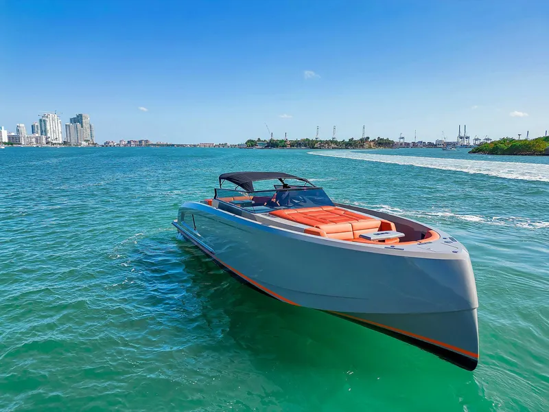 Slide: The Image of 2021 Vanquish Yachts VQ 45 cruising on clear blue waters. - 12