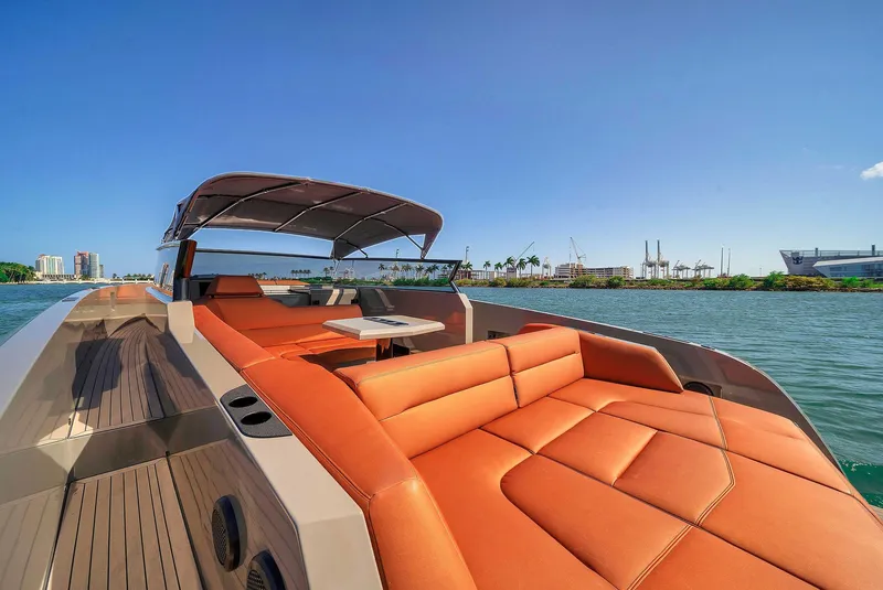 Slide: The Image of 2021 Vanquish Yachts VQ 45 with luxurious seating on a sunny day. - 28