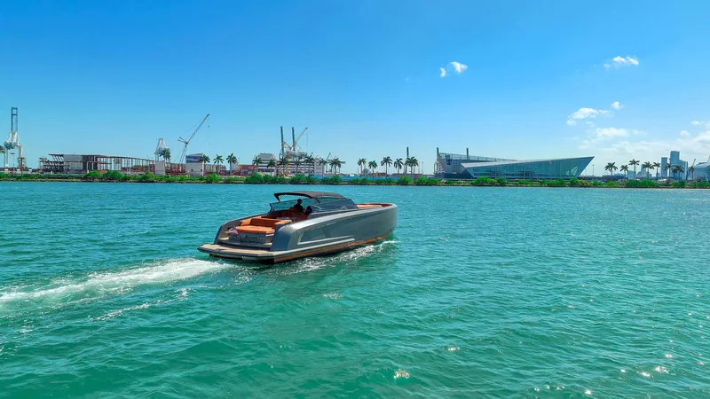 Slide: The Image of 2021 Vanquish Yachts VQ 45 cruising on a sunny day in a vibrant harbor. - 5