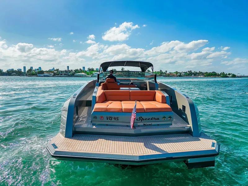 Slide: The Image of 2021 Vanquish Yachts VQ 45 on water, sunny day, luxury yacht cruising. - 18