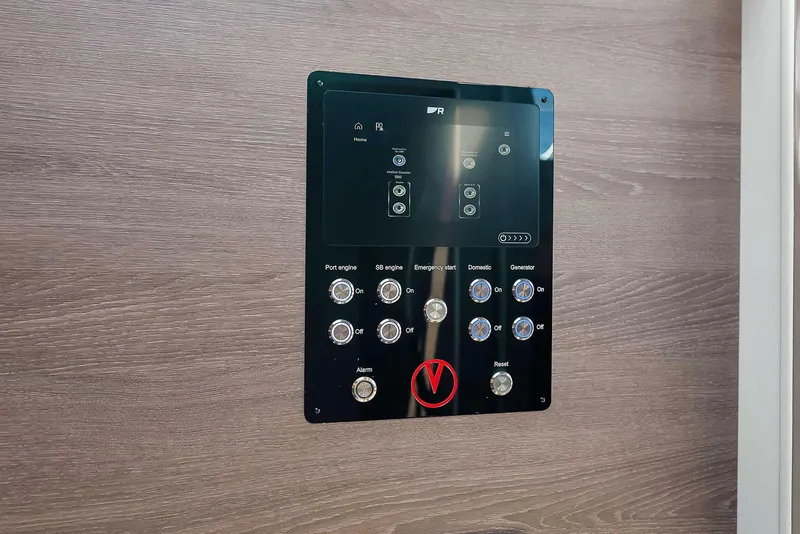 Slide: The Image of Control panel of 2021 Vanquish Yachts VQ 45, featuring buttons and display on wooden background. - 36