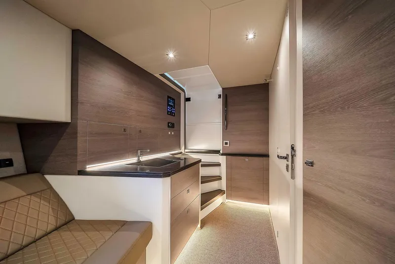 Slide: The Image of Interior of 2021 Vanquish Yachts VQ 45, featuring modern kitchen and seating area. - 39